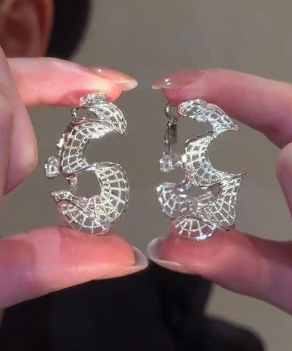 Übergroße, gold- und silberübergoldene, S-förmige Creolen mit Aussparungen in S-Form