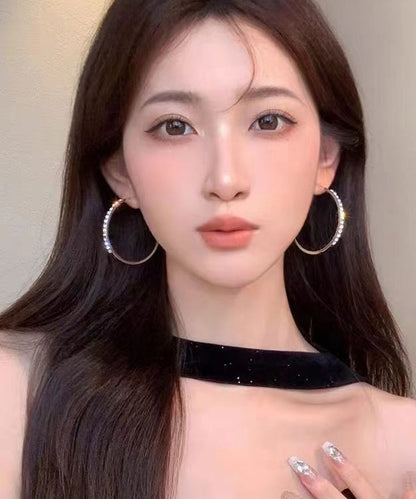 Übergroße Creolen aus Metall mit Zirkonia