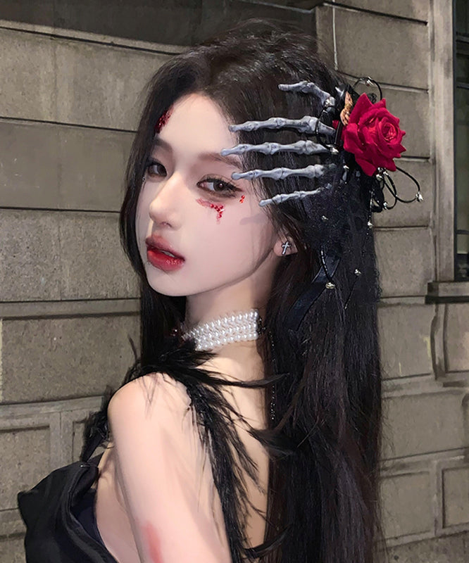 Horquilla para el pelo izquierda con forma de mano de esqueleto de rosa roja de gran tamaño