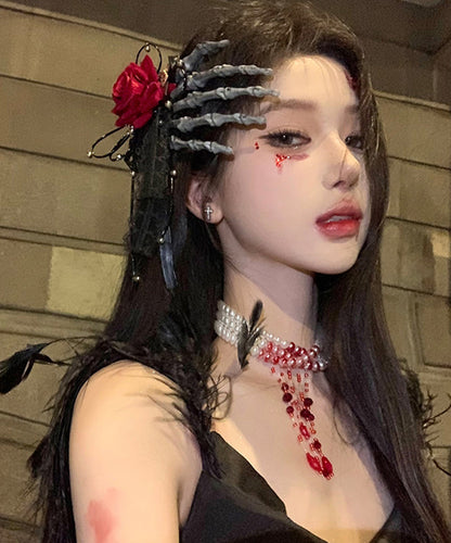 Horquilla para el pelo izquierda con forma de mano de esqueleto de rosa roja de gran tamaño