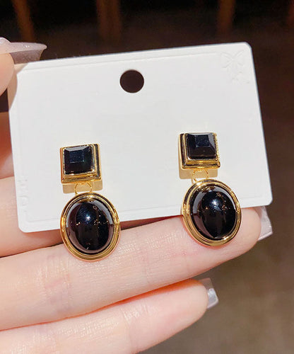 Pendientes geométricos con gotas de aceite de oro de 14 quilates y cobre negro dorado