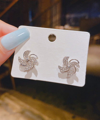 Pendientes de botón florales con circonitas doradas y plata de ley