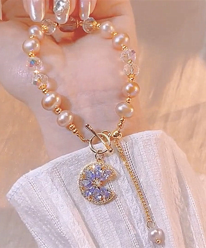 Normales lilafarbenes Charm-Armband aus Sterlingsilber mit Kristallperlen und Quaste