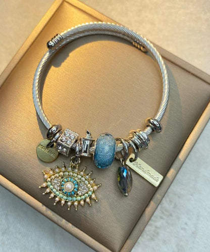 Retro-Armband aus Gold und Sterlingsilber mit Teufelsaugen-Anhänger