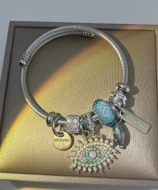 Retro-Armband aus Gold und Sterlingsilber mit Teufelsaugen-Anhänger