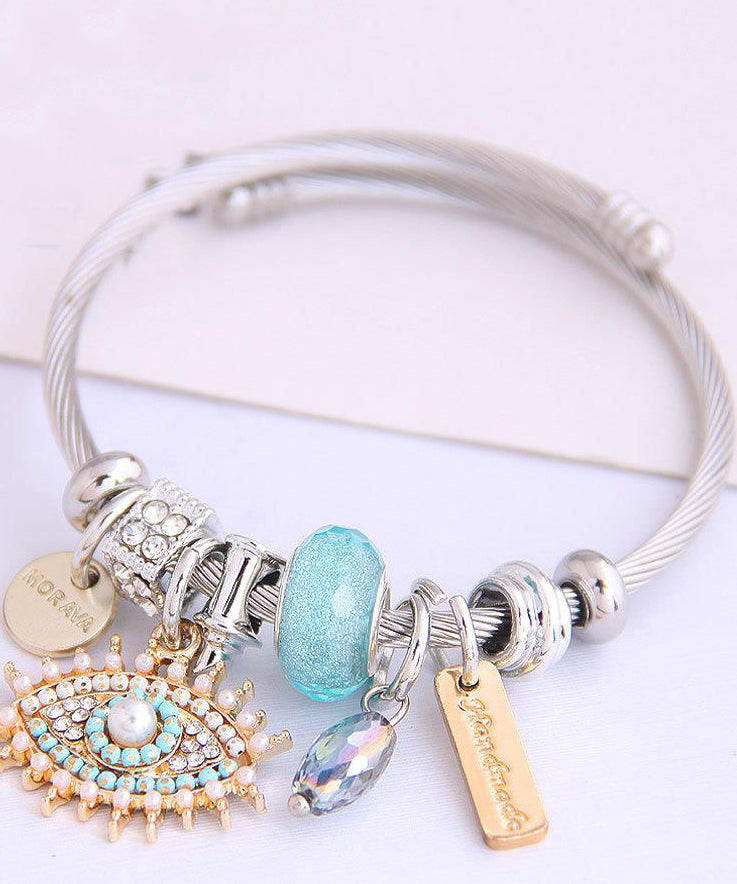 Retro-Armband aus Gold und Sterlingsilber mit Teufelsaugen-Anhänger