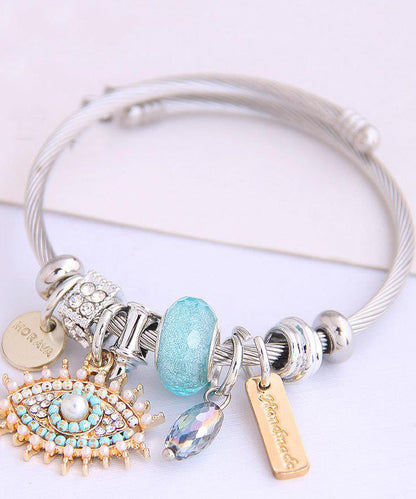 Retro-Armband aus Gold und Sterlingsilber mit Teufelsaugen-Anhänger