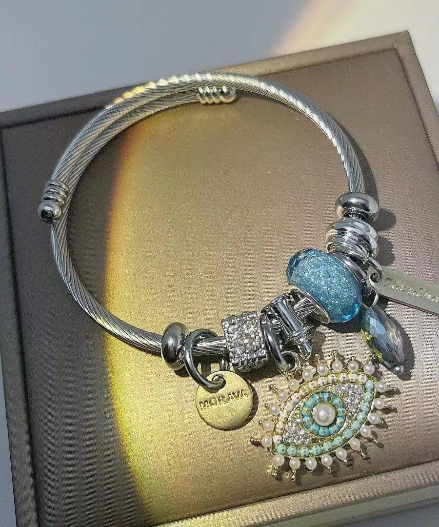 Retro-Armband aus Gold und Sterlingsilber mit Teufelsaugen-Anhänger