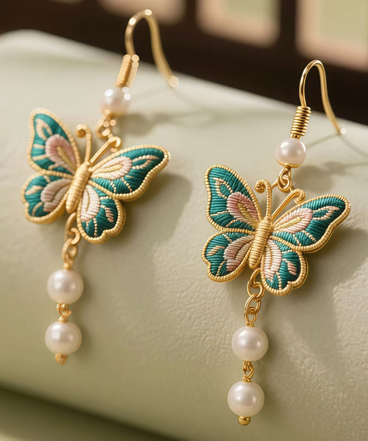 Pendientes colgantes con borlas de esmalte y mariposas de plata de ley dorada retro