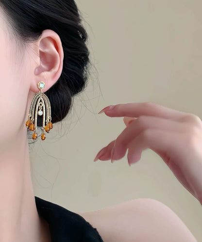 Retro-Ohrhänger mit orangefarbenem Kupferüberzug und Zirkonia-Quaste