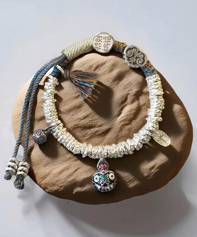 Pulsera con dije de bestia devoradora de oro, plata de ley y seda retro