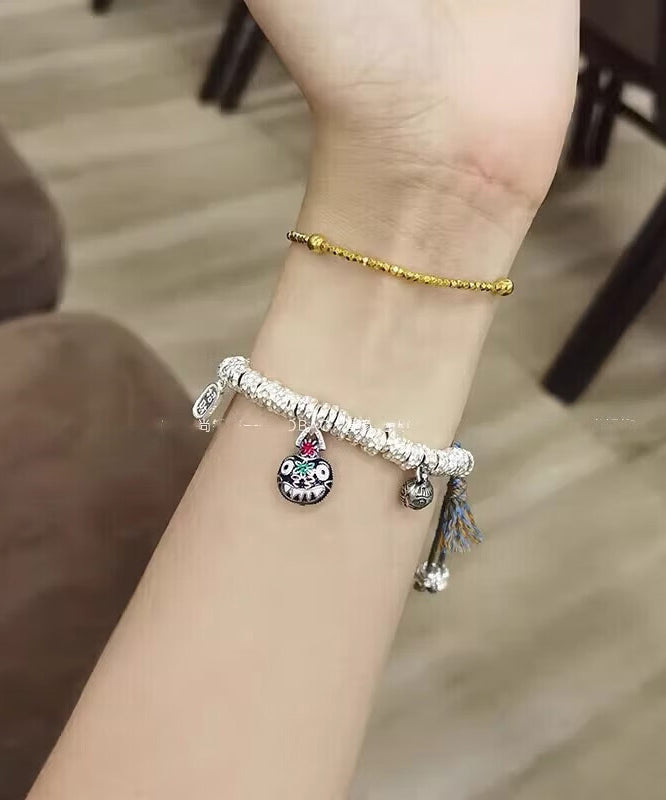 Pulsera con dije de bestia devoradora de oro, plata de ley y seda retro