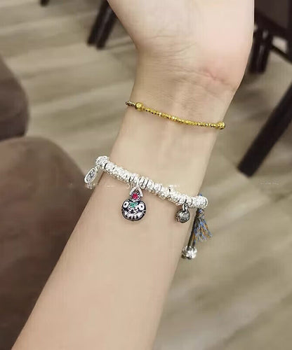 Pulsera con dije de bestia devoradora de oro, plata de ley y seda retro