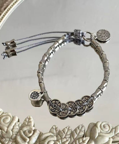 Pulsera de seda retro con borlas y cinco monedas del emperador en plata de ley