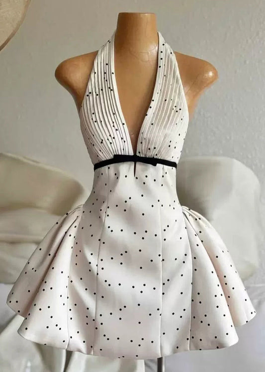 Sexy beige Minikleid aus Baumwolle mit V-Ausschnitt, rückenfrei und gepunktet, ärmellos