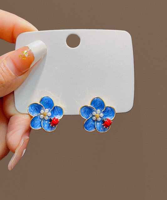 Pendientes sencillos de aleación azul con diseño de mariquita con siete estrellas y perlas de aceite