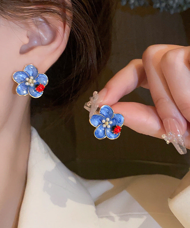 Pendientes sencillos de aleación azul con diseño de mariquita con siete estrellas y perlas de aceite