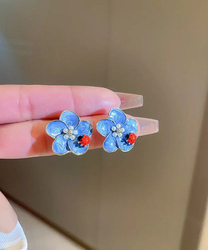 Pendientes sencillos de aleación azul con diseño de mariquita con siete estrellas y perlas de aceite