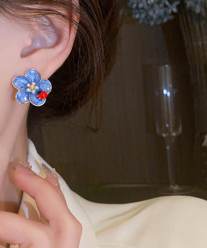 Pendientes sencillos de aleación azul con diseño de mariquita con siete estrellas y perlas de aceite