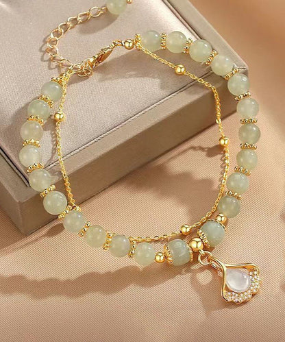 Schlichtes hellgrünes Sterlingsilber-Armband mit vergoldetem Zirkonia-Jade und Ginkgoblatt