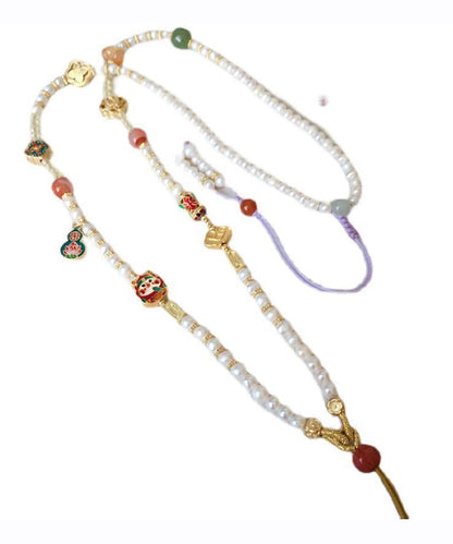 Collar sencillo con colgante de borla de calabaza y perla de circonita dorada en plata de ley blanca