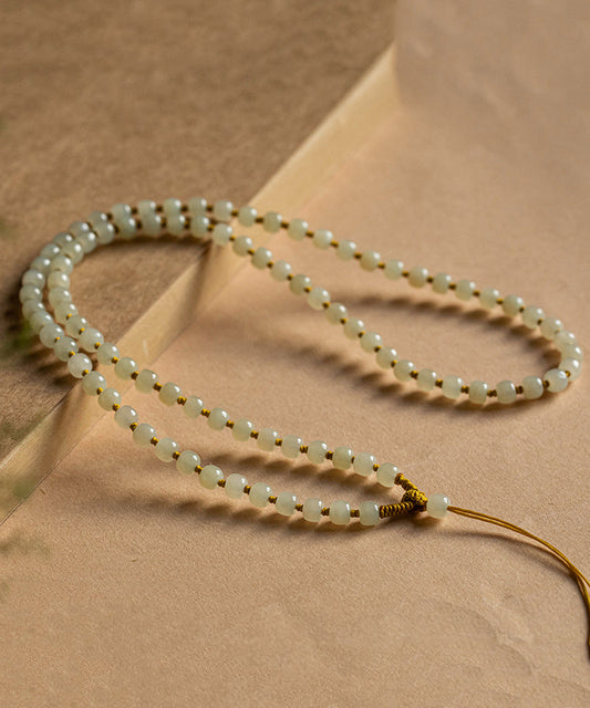 Collar sencillo de cuentas graduadas con borlas de bolas de manzana de jade amarillo