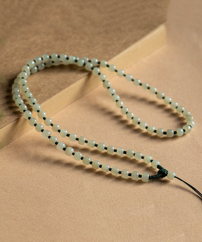 Collar sencillo de cuentas graduadas con borlas de bolas de manzana de jade amarillo