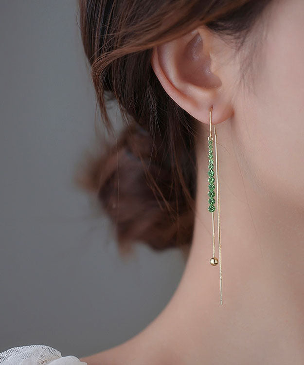 Pendientes finos de aleación de cobre azul con incrustaciones de circonitas y borlas