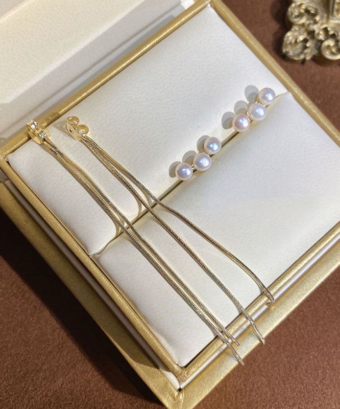 Schmale, vergoldete Ohrringe mit Perlenquaste in Kupferoptik