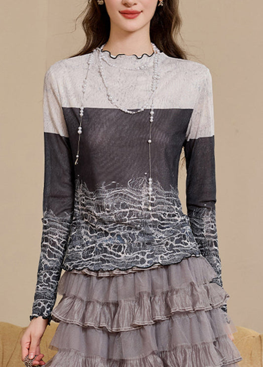 Top ajustado con cuello alto, estampado y bloques de color para primavera