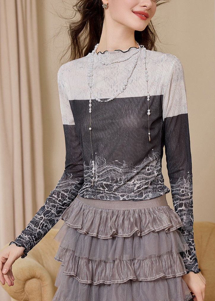 Top ajustado con cuello alto, estampado y bloques de color para primavera