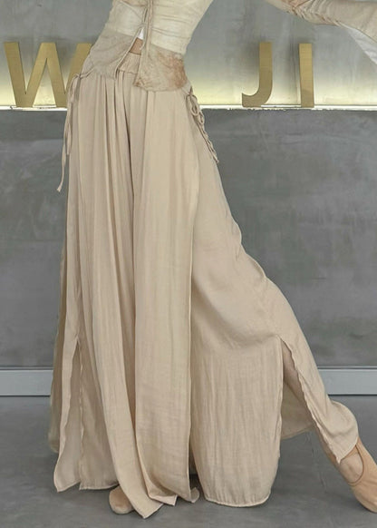 Beigefarbene Baumwollhose mit elastischem Bund, seitlichem Schlitz und weitem Bein, Frühlingsstil