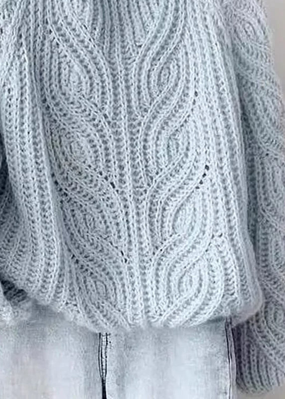 Suéteres de punto de cable de algodón acogedores con cuello alto azul y mangas farol