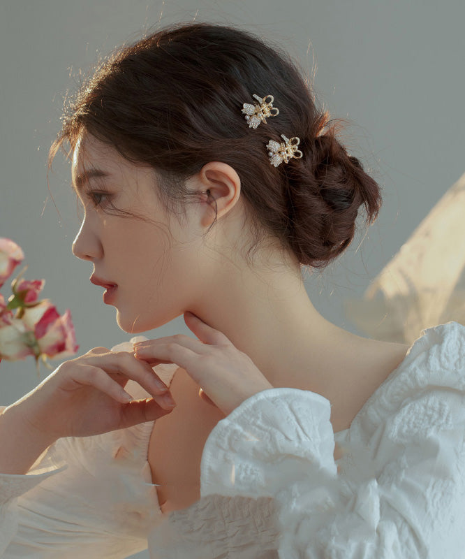 Horquilla de aleación de oro con circonitas y perlas de lirio de los valles