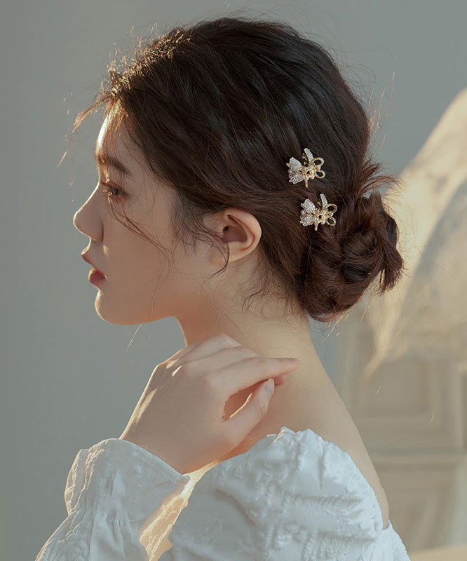 Horquilla de aleación de oro con circonitas y perlas de lirio de los valles