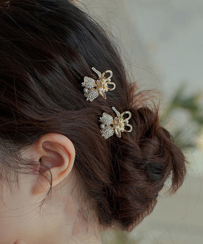 Horquilla de aleación de oro con circonitas y perlas de lirio de los valles