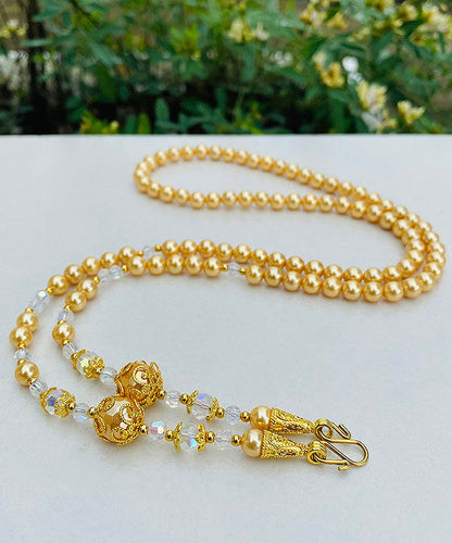 Collar de cuentas de suéter con detalles dorados y degradados