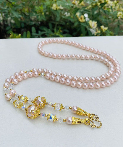 Collar de cuentas de suéter con detalles dorados y degradados