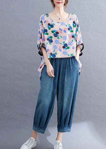 Stil: Rosafarbenes Oberteil mit Rundhalsausschnitt, asymmetrischem Design und Rüschen