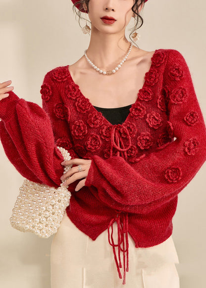 Suéter de punto de algodón liso con cuello en V y cordón ajustable, color rojo y mangas farol.