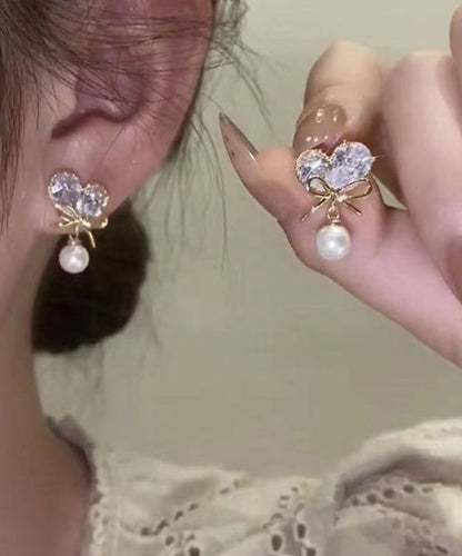 Pendientes colgantes con borlas y lazo de amor de perla y circonita de aleación de cobre blanco