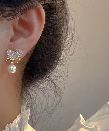 Pendientes colgantes con borlas y lazo de amor de perla y circonita de aleación de cobre blanco