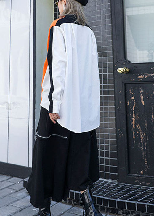 Elegante top de punto de otoño con diseño asimétrico de bolsillos naranjas y patchwork negro