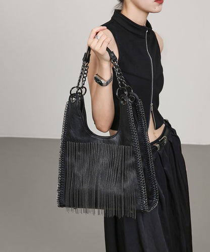 Elegante bolso de hombro de piel sintética con borlas negras y gran capacidad