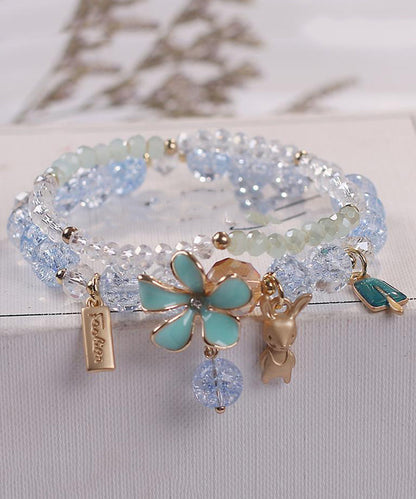 Elegante pulsera de aleación azul con cristales de circonita y dije floral