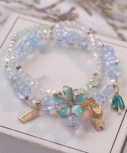 Elegante pulsera de aleación azul con cristales de circonita y dije floral