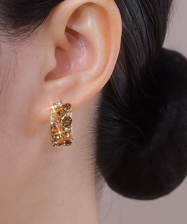 Elegantes pendientes de aro de plata de ley con circonitas doradas en color café