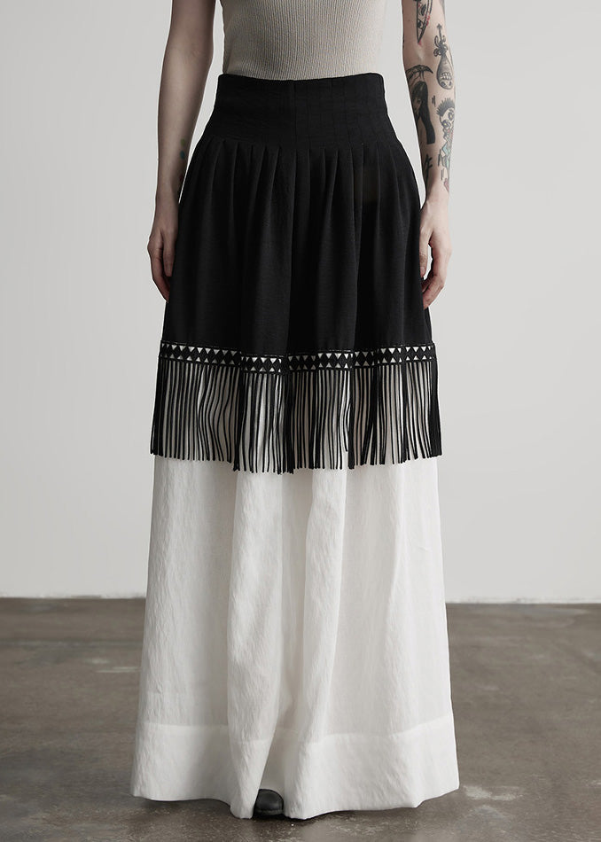 Stilvoller, farblich abgesetzter Patchwork-Baumwollrock mit Quasten für den Frühling