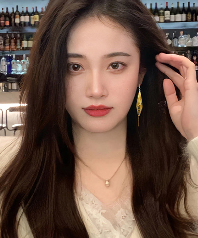 Elegantes pendientes colgantes con borlas huecas de aleación de oro