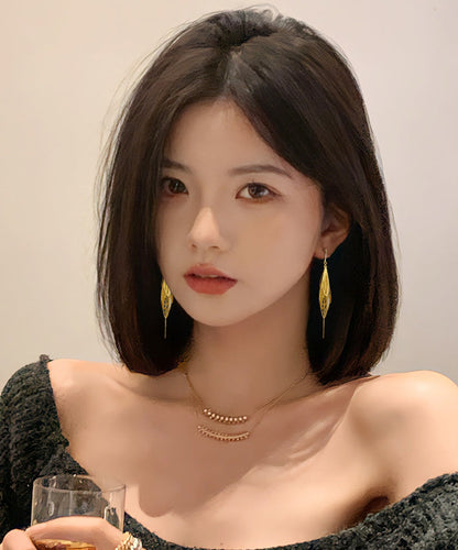 Elegantes pendientes colgantes con borlas huecas de aleación de oro